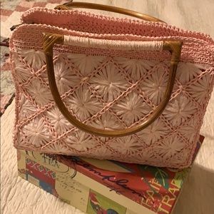 Pink evolving bag with bamboo handles